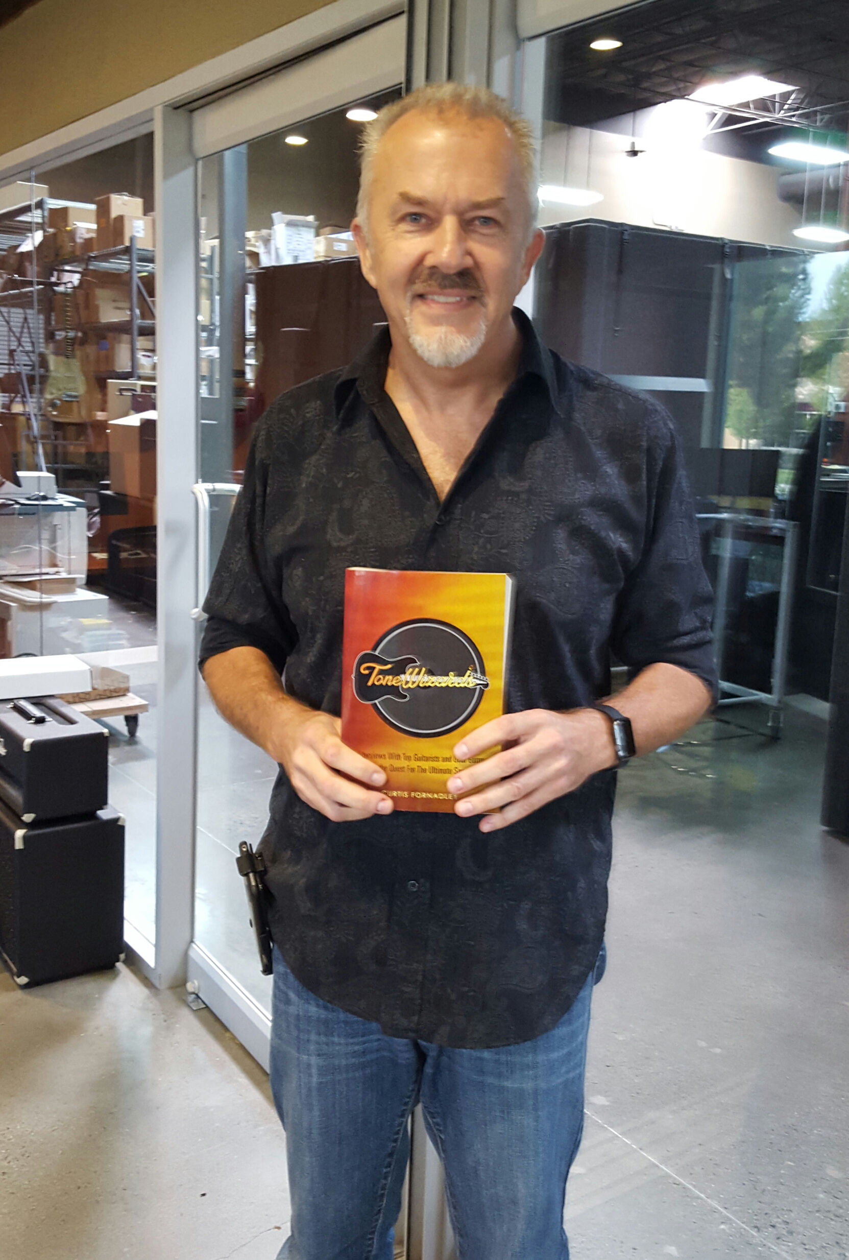 John Suhr with his copy of Tone Wizards